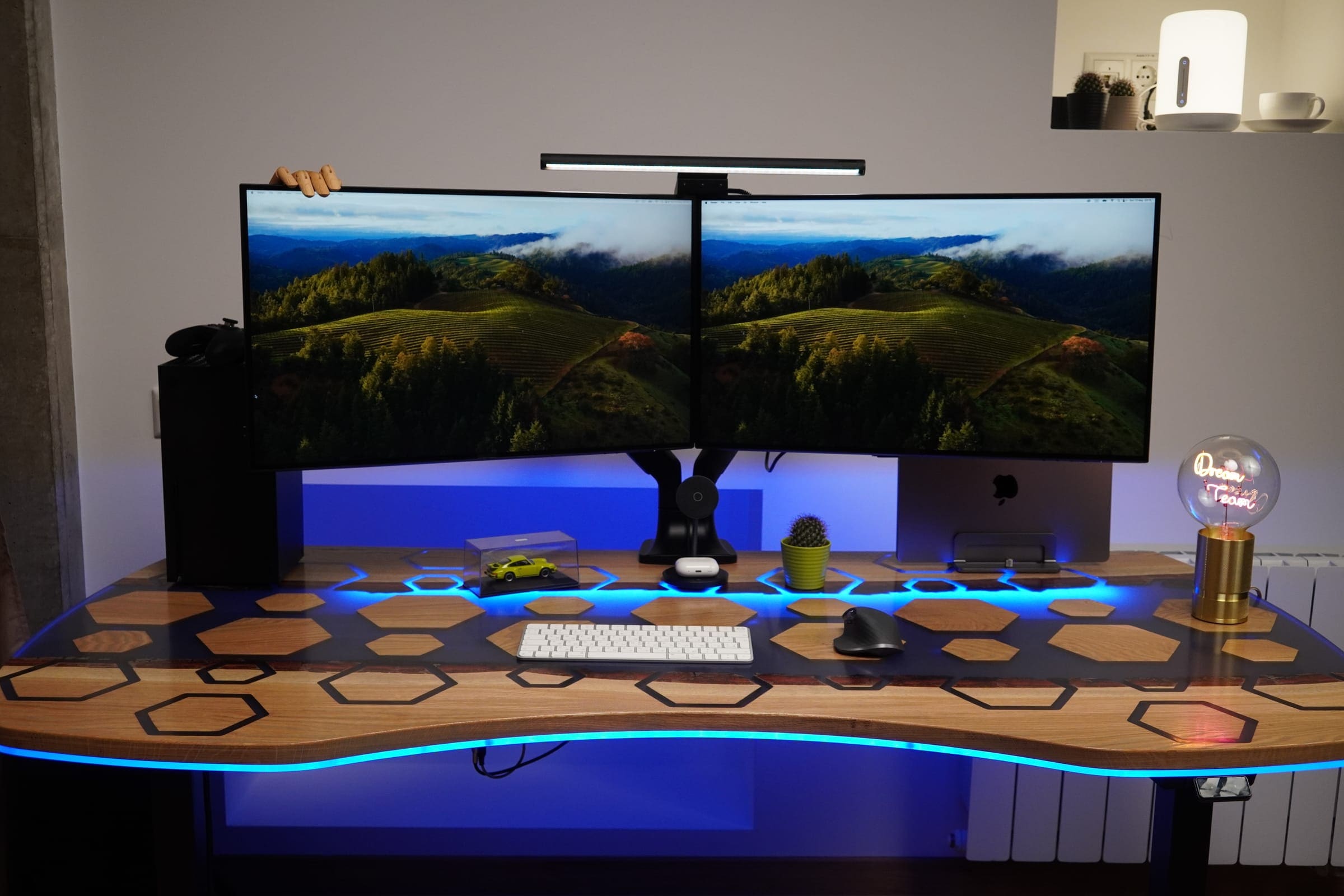 Hexagon epoxy desk with LED edge lighting and two monitors